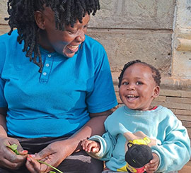 A cheerful woman and child
