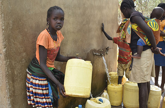 A young girl gathering water